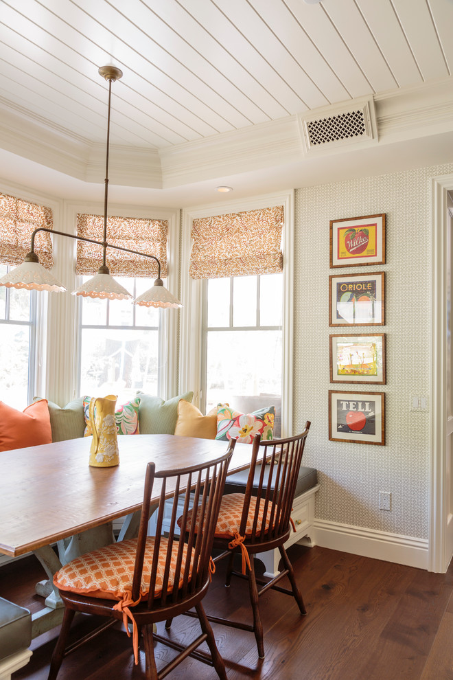 Elegant medium tone wood floor kitchen/dining room combo photo in Los Angeles with beige walls