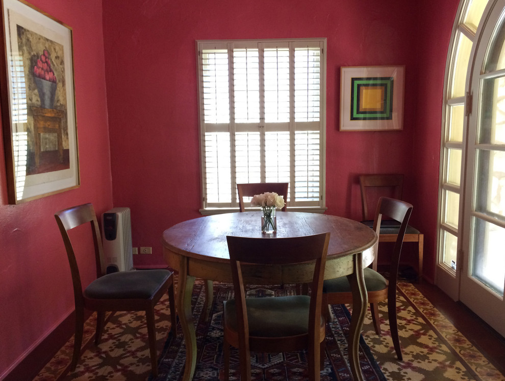Eclectic dining room in Other with pink walls.