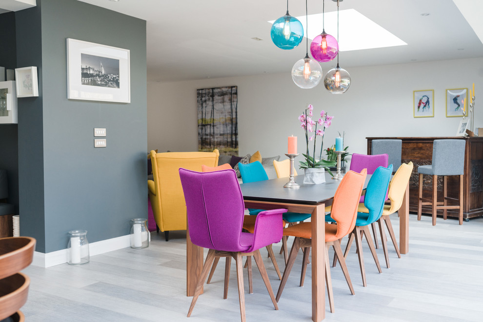 Great room - large contemporary vinyl floor and gray floor great room idea in Berkshire with gray walls, a wood stove and a stone fireplace