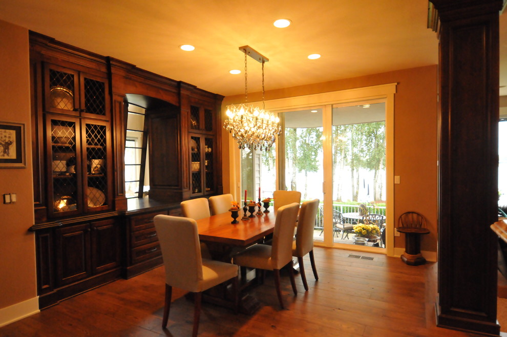 Inspiration for a medium sized classic enclosed dining room in Portland with brown walls, dark hardwood flooring, no fireplace and brown floors.