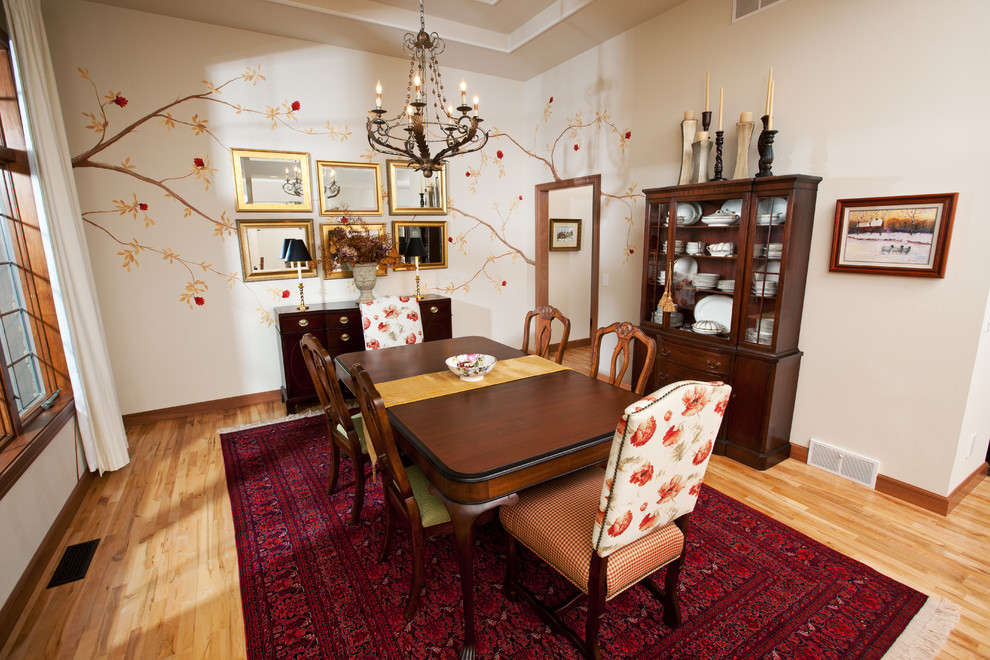 Example of a mid-sized classic light wood floor enclosed dining room design in Other with white walls and no fireplace