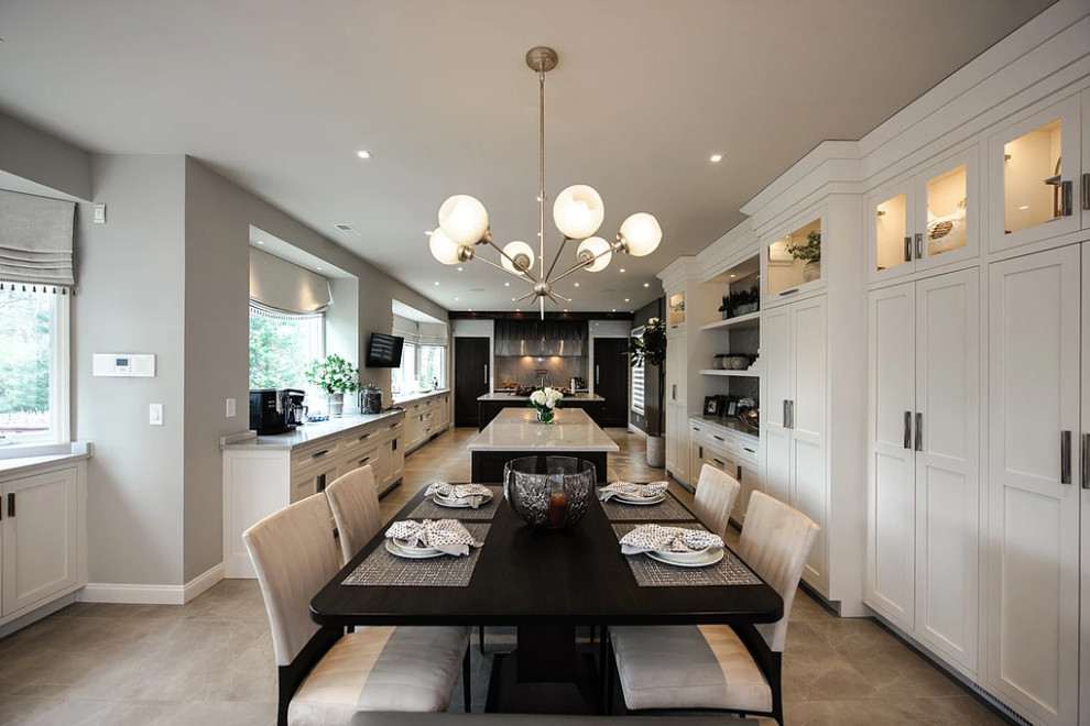 На фото: кухня-столовая среднего размера в современном стиле с серыми стенами, полом из известняка и серым полом без камина