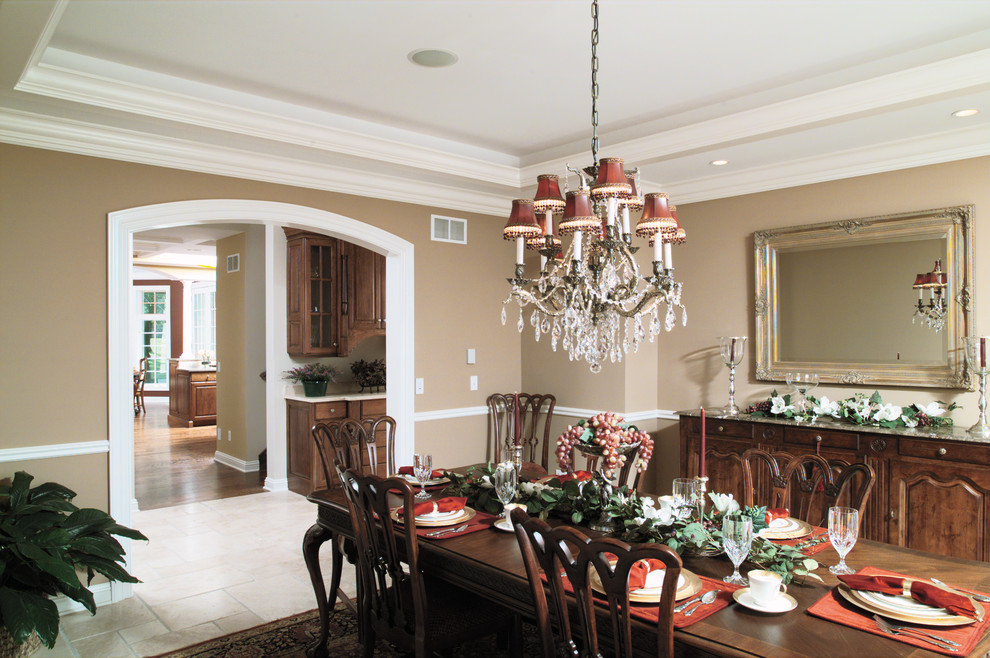 Photo of a classic dining room in Chicago with beige walls and marble flooring.