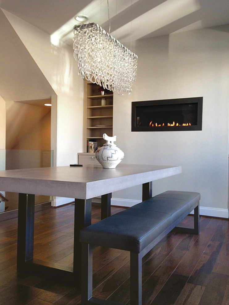 This is an example of a large contemporary kitchen/dining room in New York with dark hardwood flooring.