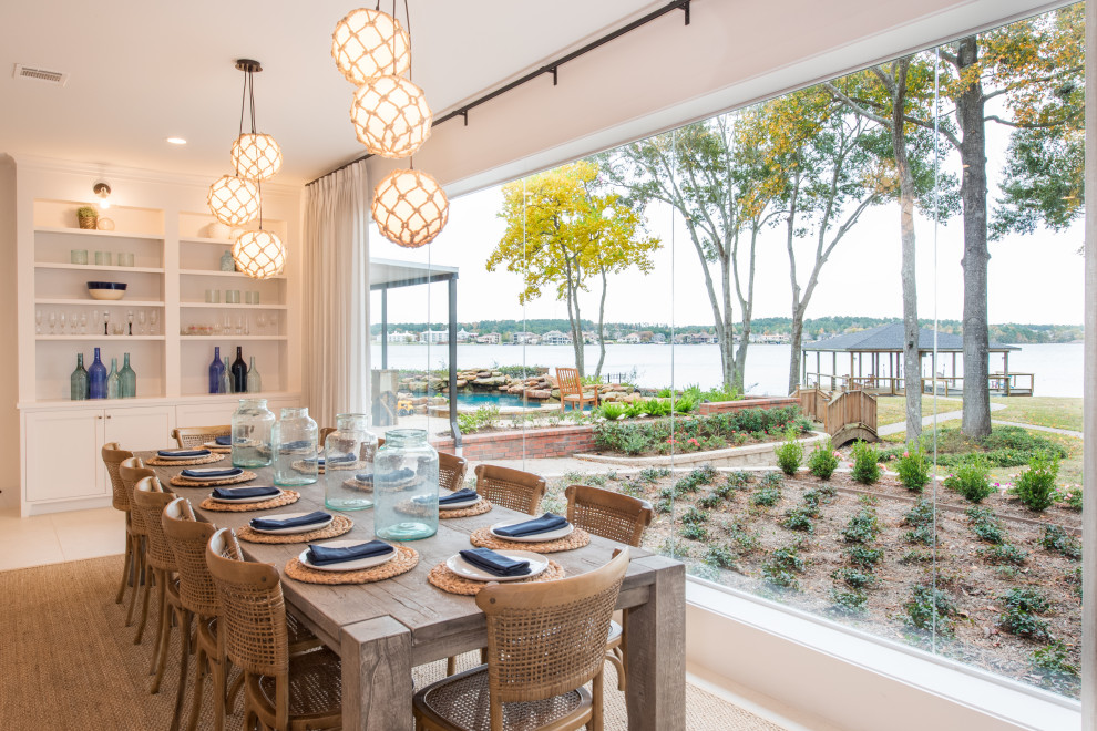 Dining room - coastal dining room idea in Dallas with white walls