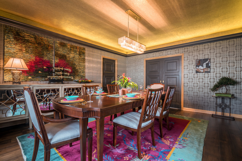 Medium sized world-inspired enclosed dining room in Milwaukee with metallic walls, dark hardwood flooring and feature lighting.