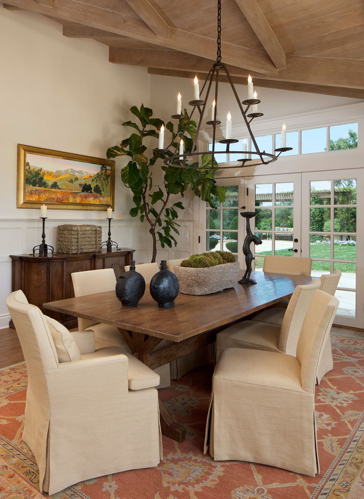 Traditional dining room in Santa Barbara with white walls.