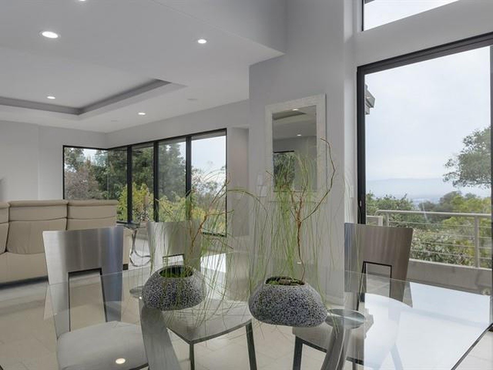 Inspiration for a large contemporary open plan dining room in San Francisco with grey walls, porcelain flooring, no fireplace and white floors.