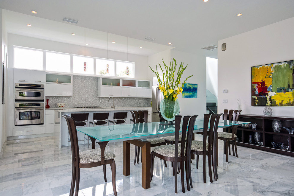 Photo of an expansive contemporary kitchen/dining room in Jacksonville with white walls and no fireplace.