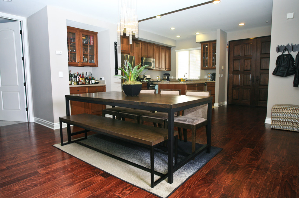 This is an example of a medium sized contemporary open plan dining room in Los Angeles with grey walls and medium hardwood flooring.