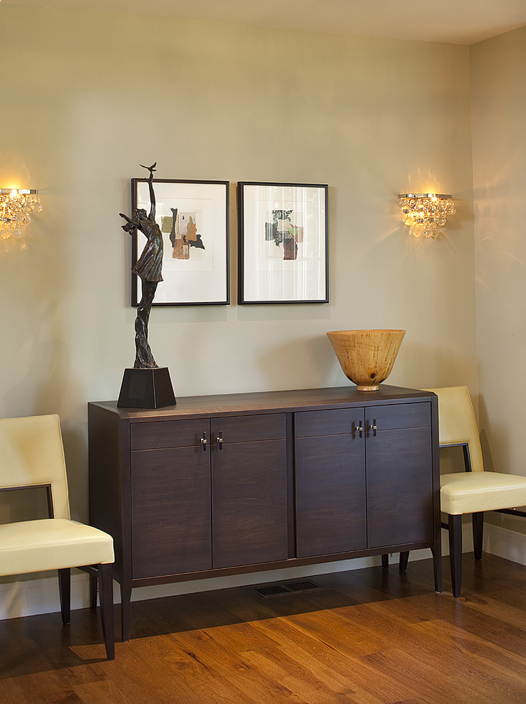 Inspiration for a contemporary dark wood floor dining room remodel in San Francisco with beige walls