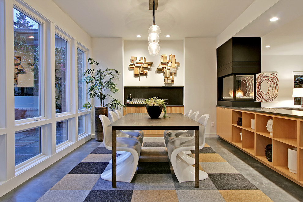 Example of a trendy dining room design in Seattle with white walls