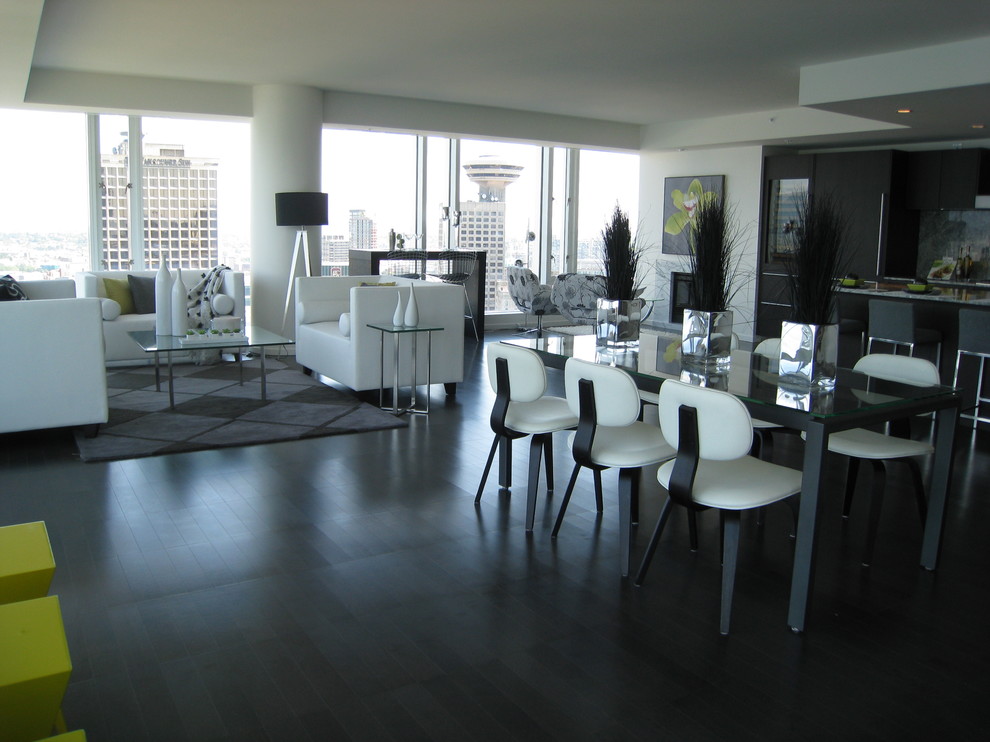Dining room - contemporary black floor dining room idea in Vancouver with white walls