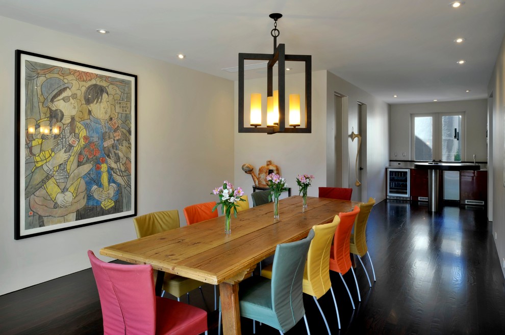 Photo of a contemporary dining room in Denver with white walls and dark hardwood flooring.