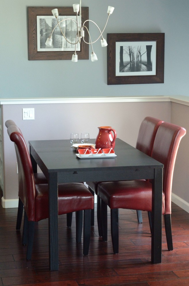 Contemporary dining room in Other with blue walls and dark hardwood flooring.