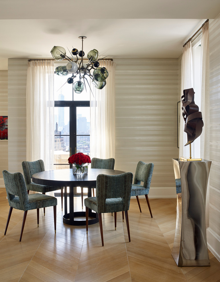 Inspiration for a contemporary dining room in New York with beige walls and light hardwood flooring.
