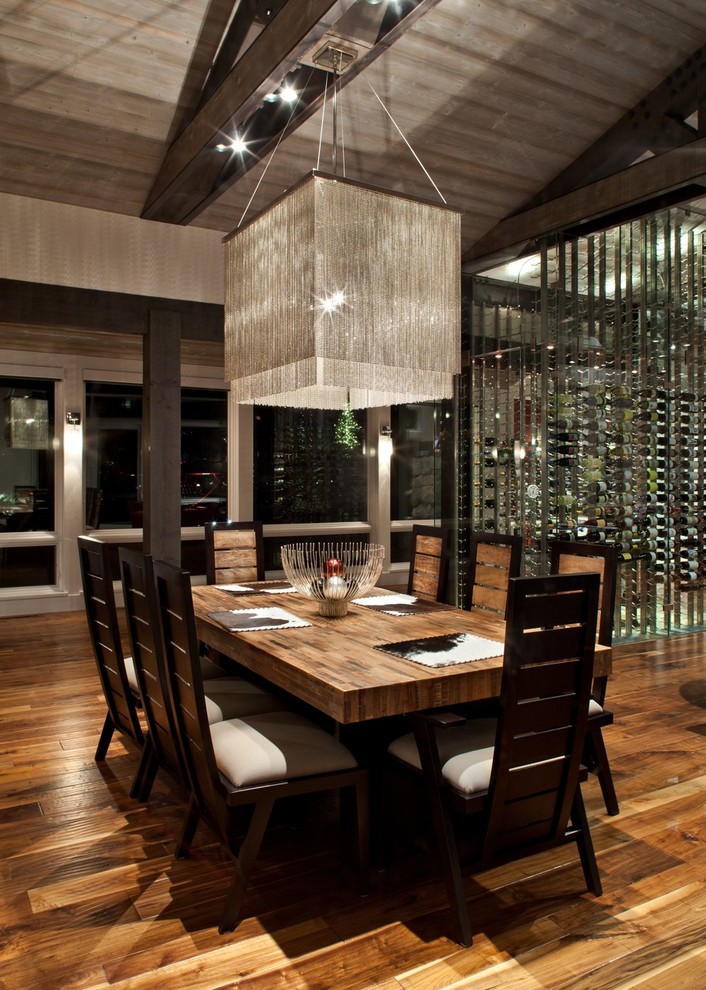 Photo of a contemporary dining room in Salt Lake City with dark hardwood flooring and brown floors.