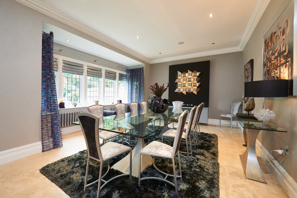 Trendy light wood floor enclosed dining room photo in Manchester with gray walls