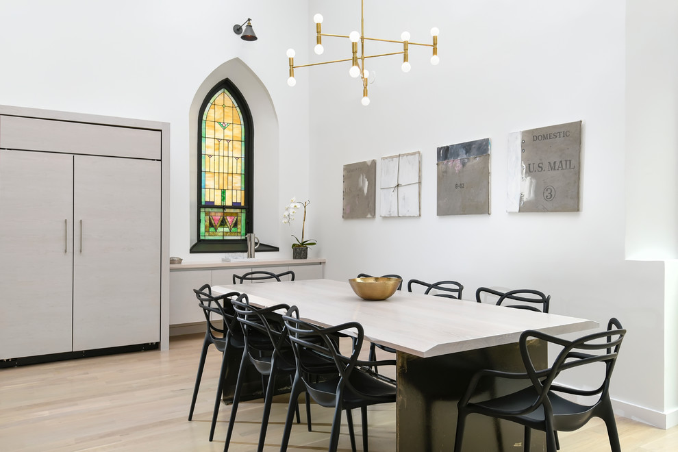 Trendy light wood floor dining room photo in Chicago with white walls