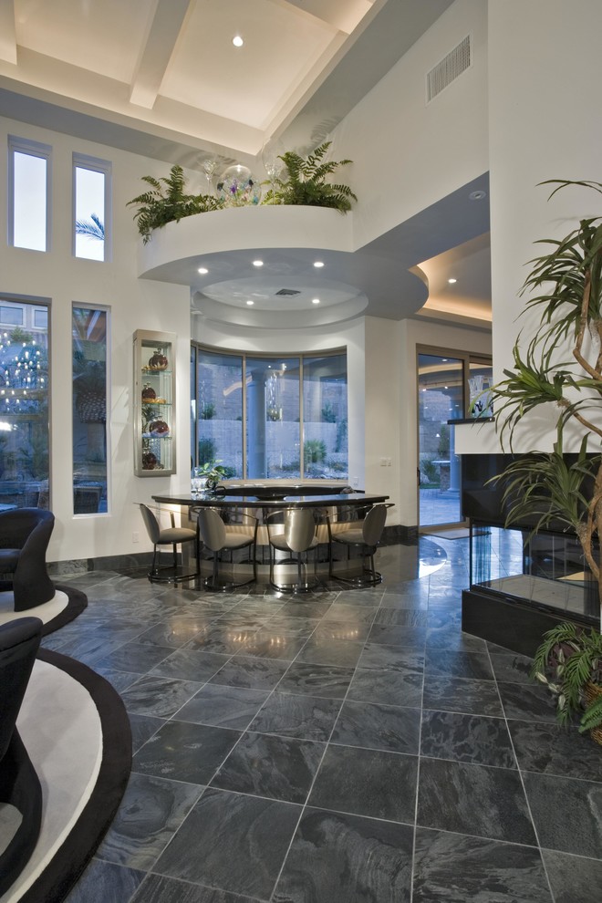 Contemporary dining room in Las Vegas with white walls.