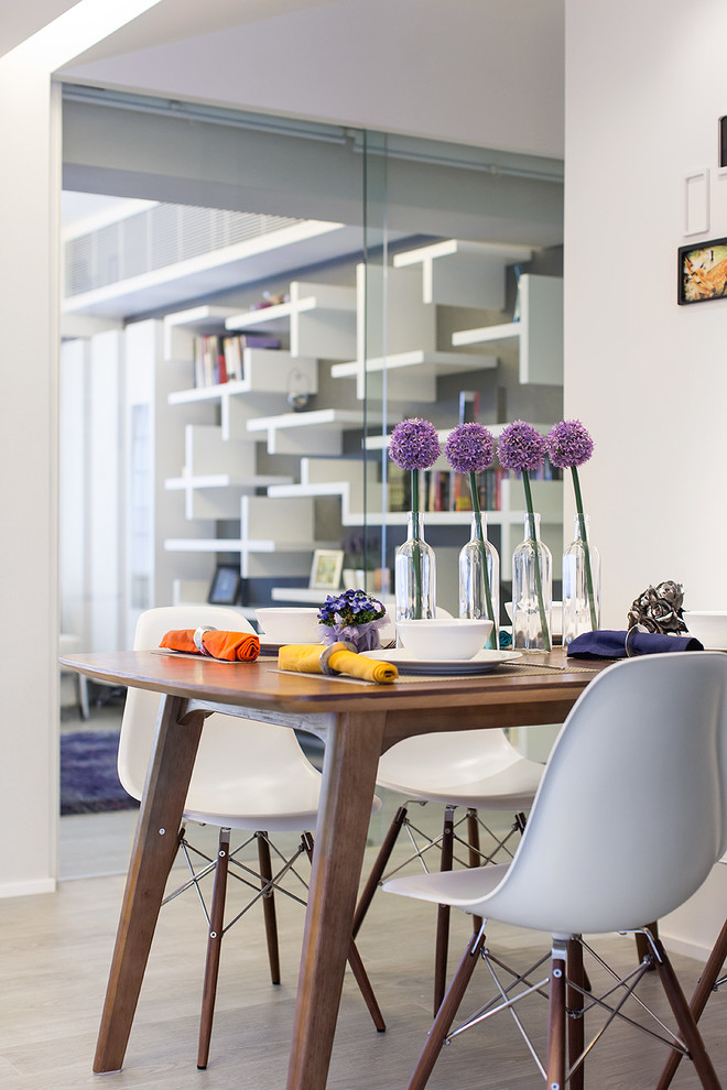 Example of a trendy dining room design in Hong Kong with white walls