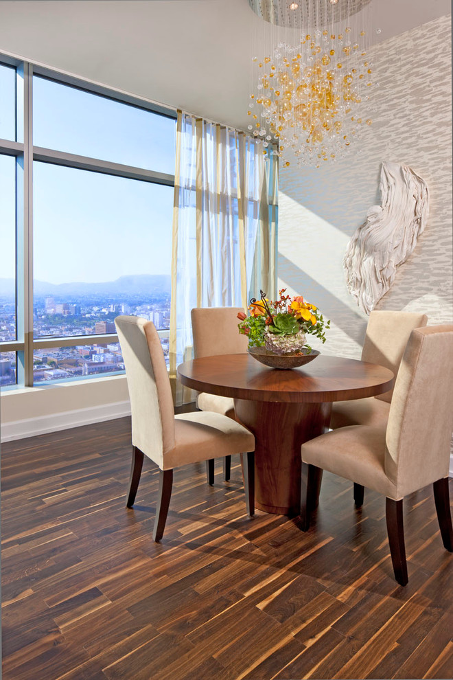 Design ideas for a contemporary dining room in Los Angeles with white walls and dark hardwood flooring.