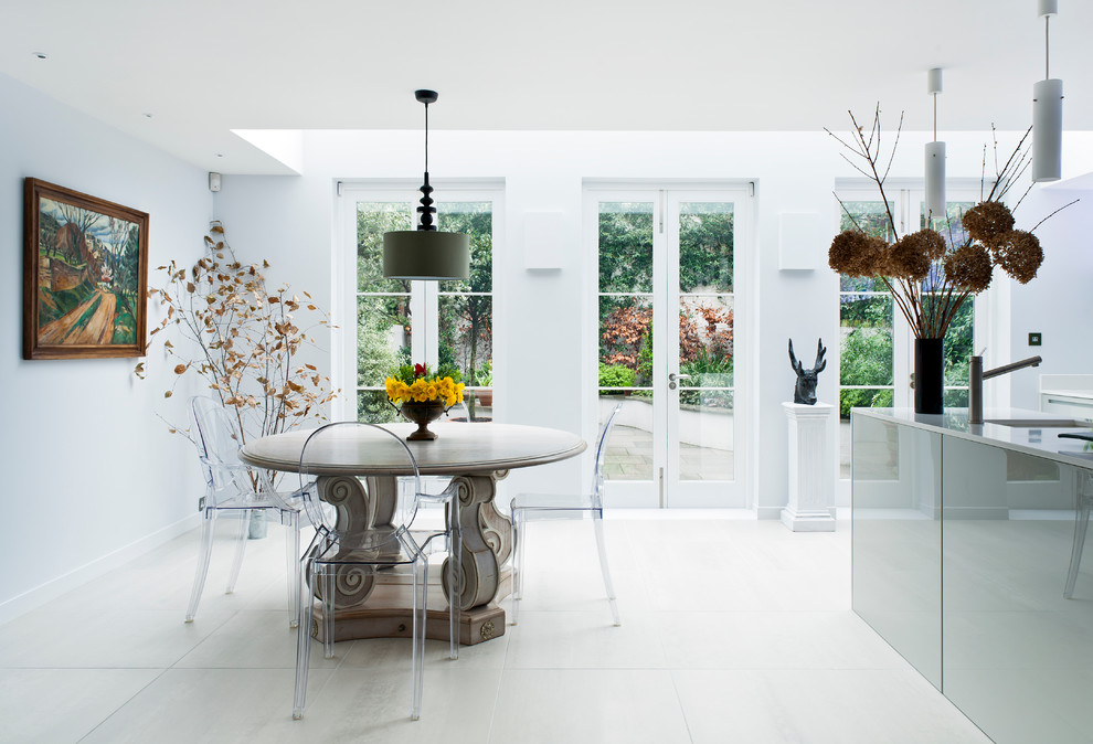 Contemporary dining room in London with white walls.