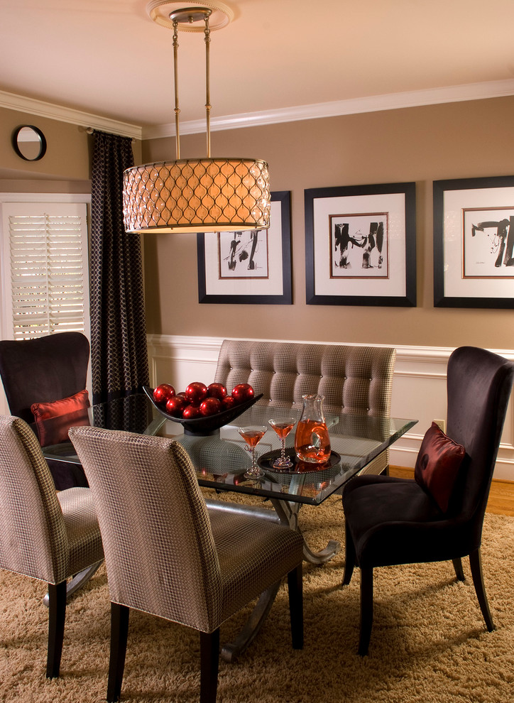Inspiration for a contemporary dining room in San Diego with brown walls and carpet.