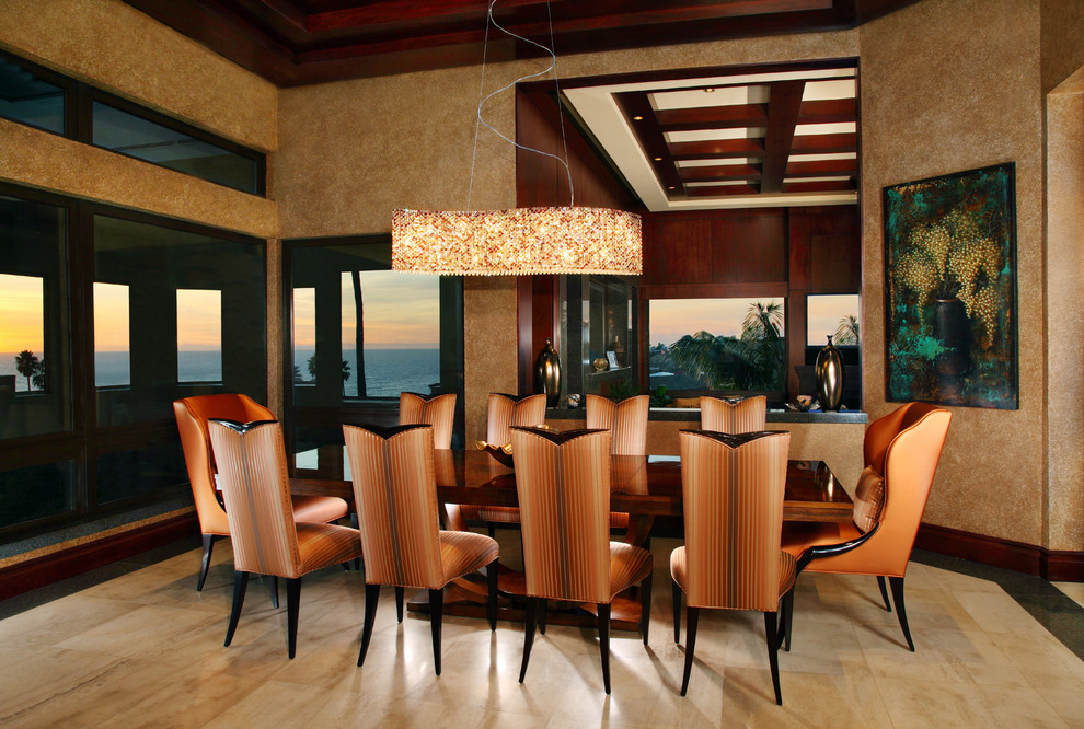 Inspiration for a contemporary dining room remodel in Orange County with beige walls