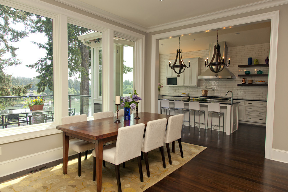 Inspiration for a contemporary dark wood floor dining room remodel in Portland with beige walls