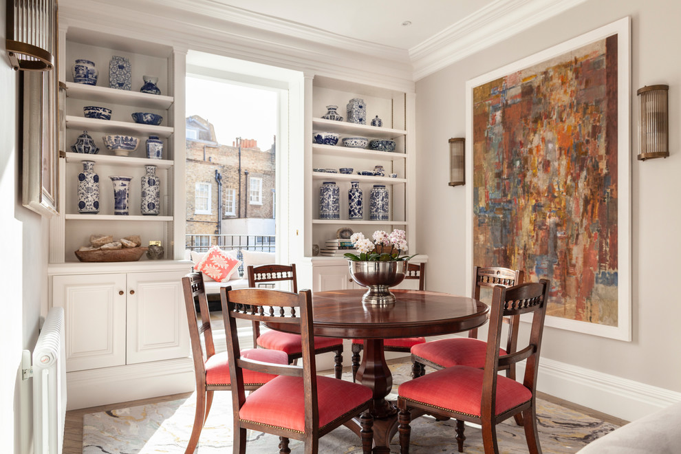 Design ideas for a small traditional dining room in London with beige walls and no fireplace.