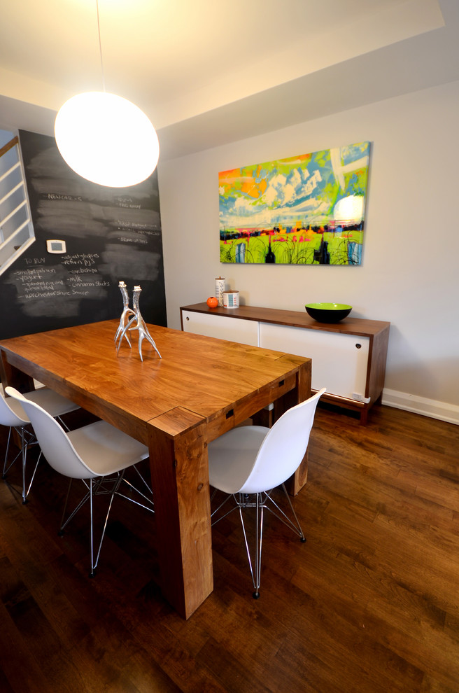 Contemporary dining room in Ottawa with grey walls and dark hardwood flooring.