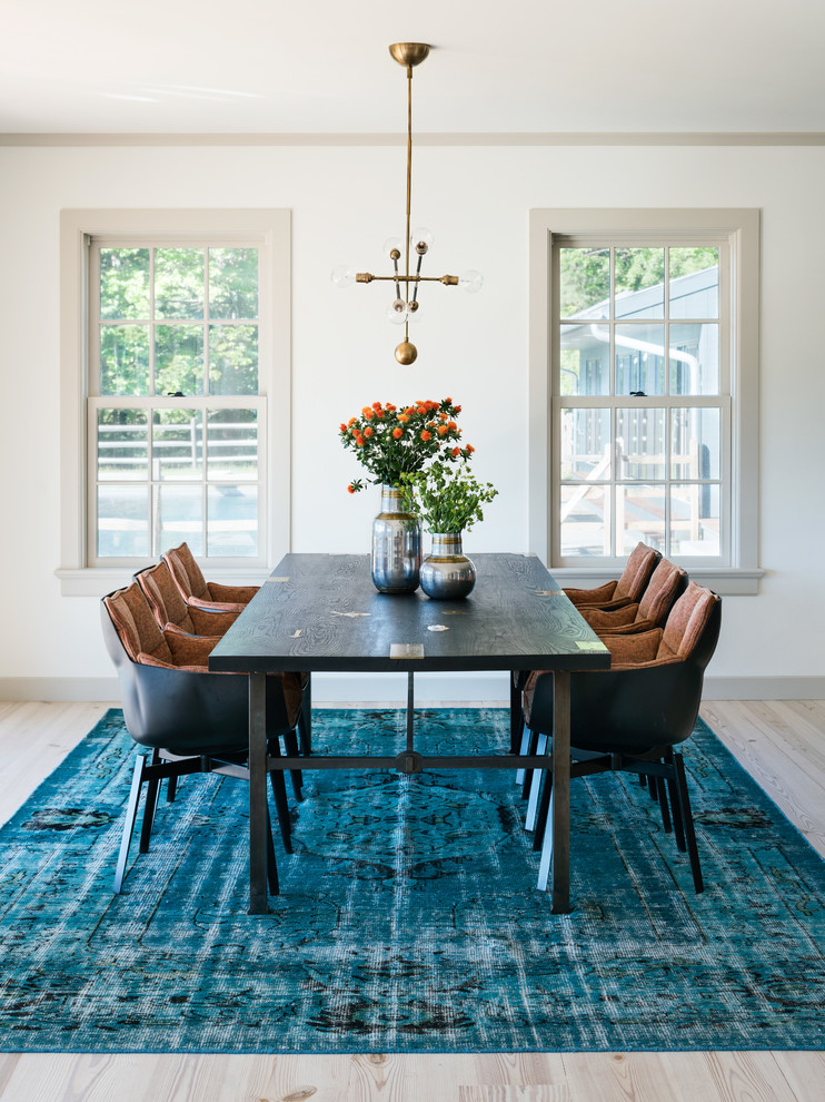 Inspiration for a transitional light wood floor dining room remodel in New York with white walls