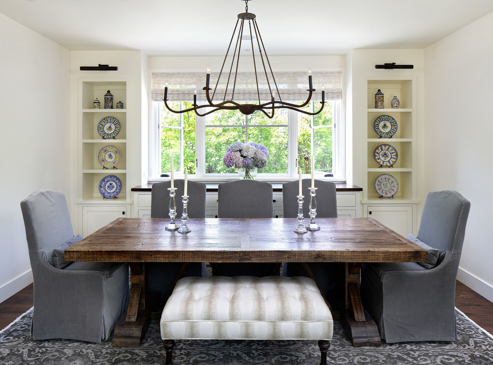 Photo of a country dining room in San Francisco with white walls, dark hardwood flooring and brown floors.
