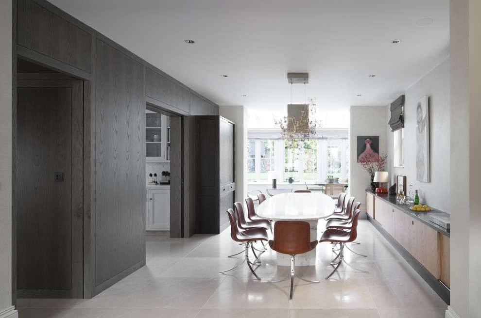 Inspiration for a large contemporary dining room in London with white walls.
