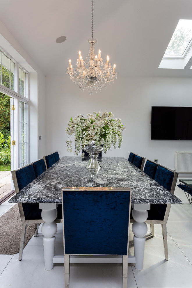 Photo of a classic open plan dining room in Hertfordshire with white walls and white floors.