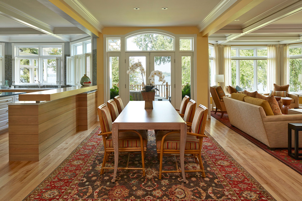 Example of a transitional dining room design in Minneapolis with yellow walls