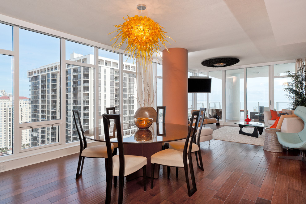 This is an example of a contemporary open plan dining room in Tampa.