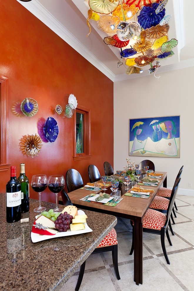 Inspiration for a contemporary dining room in Miami with red walls.