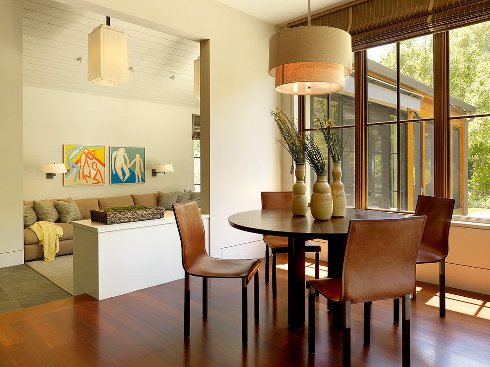 Design ideas for a contemporary dining room in San Francisco with beige walls and medium hardwood flooring.