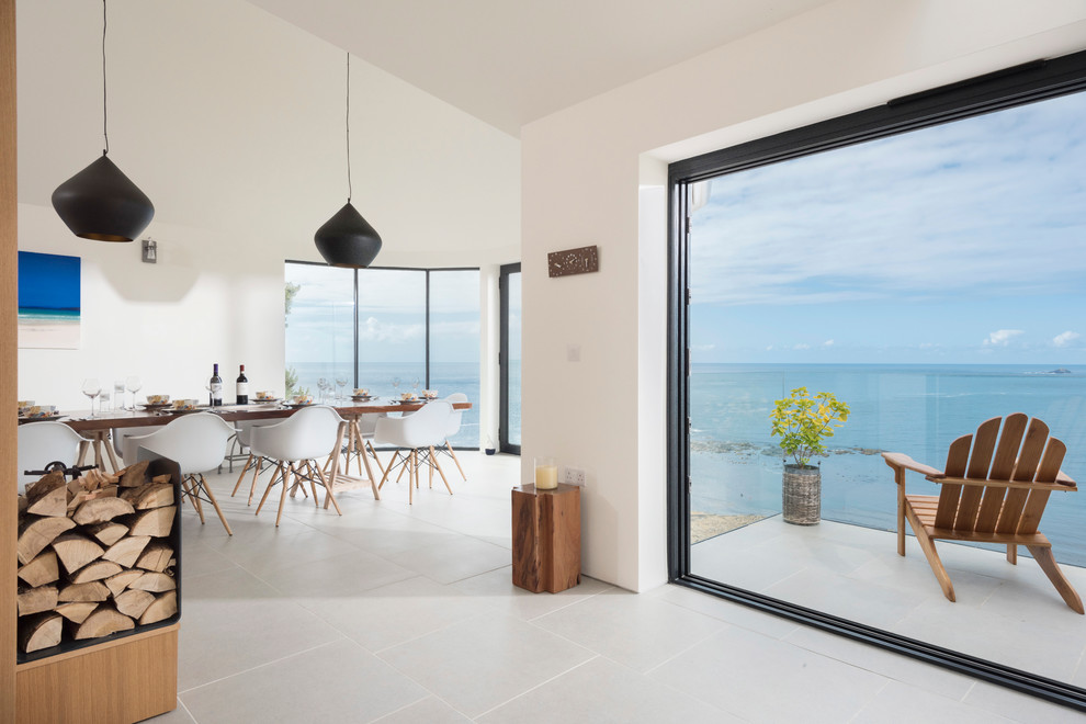 This is an example of a contemporary dining room in Cornwall.
