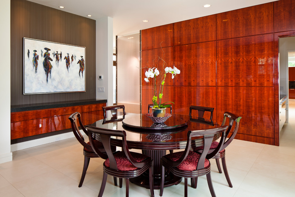 World-inspired dining room in Chicago with beige floors.