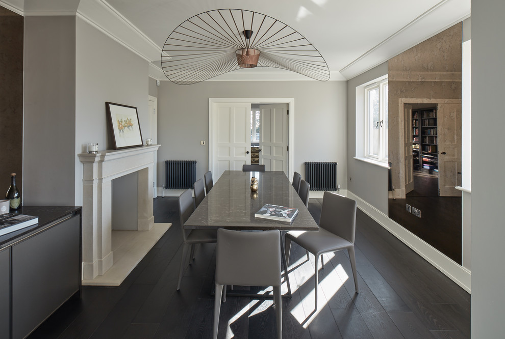 This is an example of a large contemporary dining room in Other with dark hardwood flooring, black floors and grey walls.