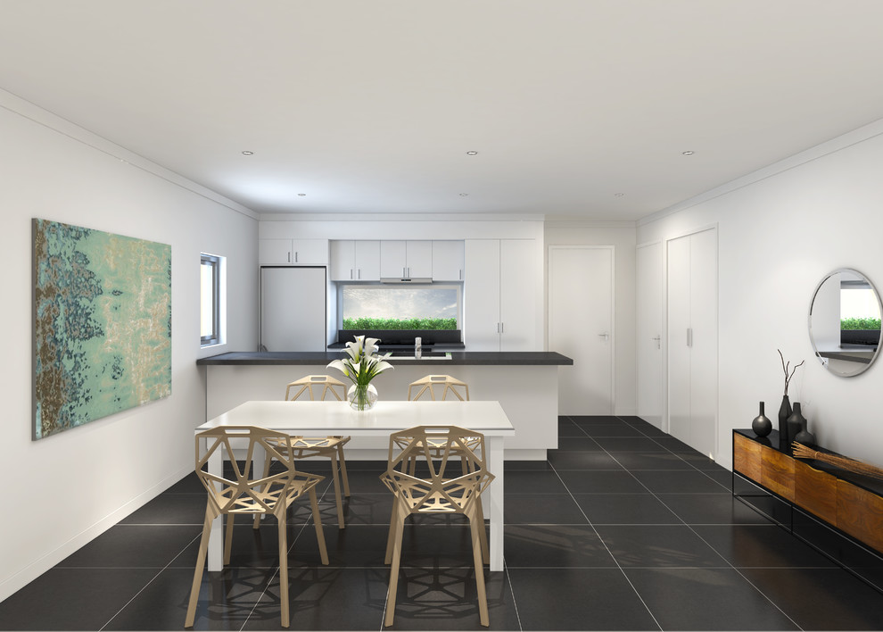 Esempio di una piccola sala da pranzo aperta verso il soggiorno minimalista con pareti bianche, pavimento con piastrelle in ceramica e pavimento nero
