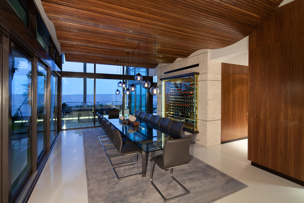 This is an example of a large contemporary open plan dining room in Miami.