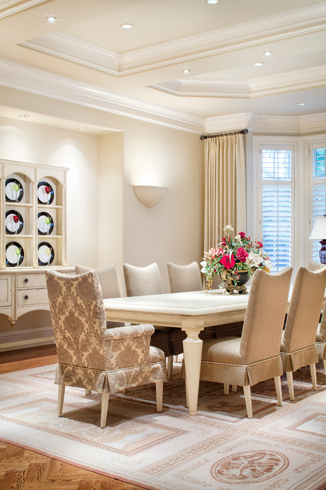 Example of a classic medium tone wood floor dining room design in Austin with beige walls