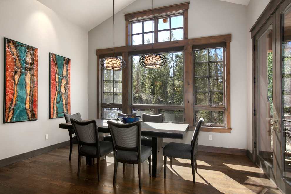 Inspiration for a rustic dining room in Denver with white walls, medium hardwood flooring and brown floors.