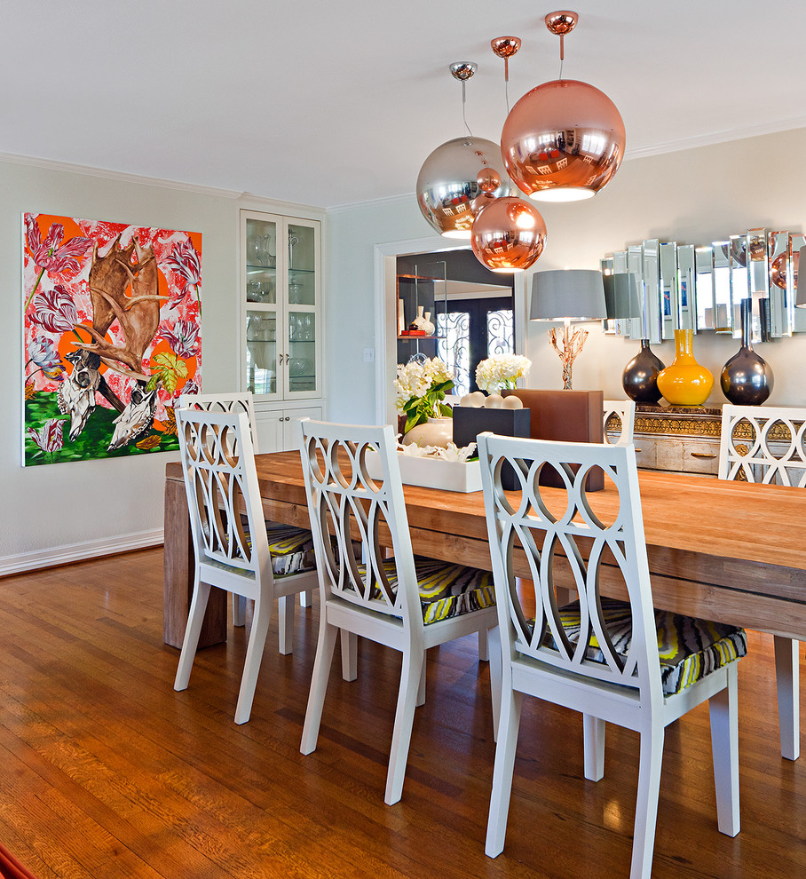 Traditional dining room in San Diego with beige walls and medium hardwood flooring.