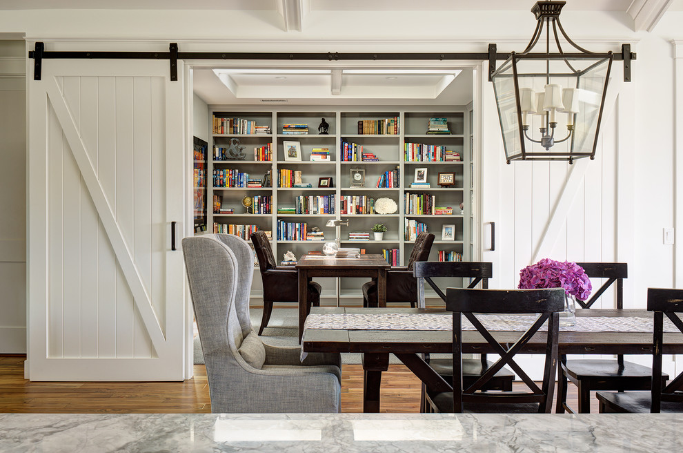 Design ideas for a small rural enclosed dining room in San Diego with white walls, dark hardwood flooring and brown floors.