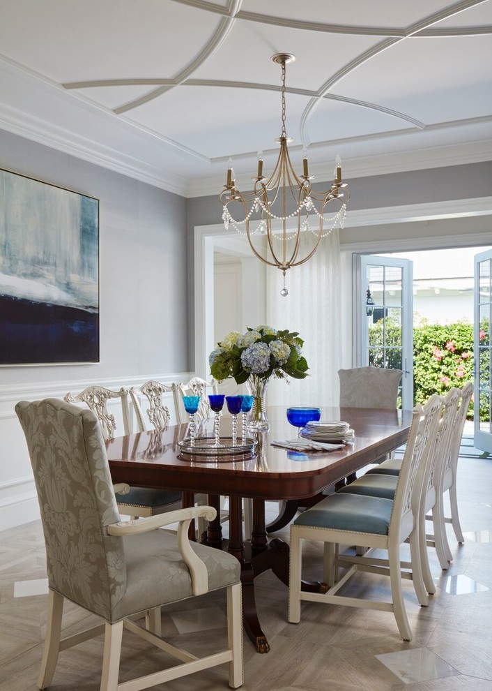 Beach style beige floor dining room photo in Miami with gray walls